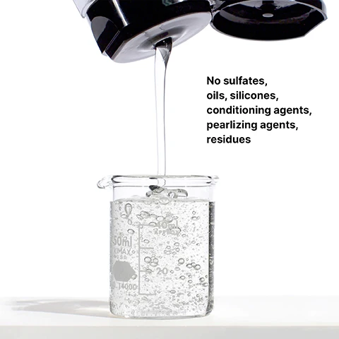 Image 3 - A liquid is being poured from a black container into a clear glass beaker filled with bubbling water, with visible text stating No sulfates, oils, silicones, conditioning agents, pearlizing agents, residues.
Image 4 - A hand holding a bottle of WOW Color Security Shampoo with bubbles surrounding it, accompanied by the text Rich-lathering, sulfate-free.