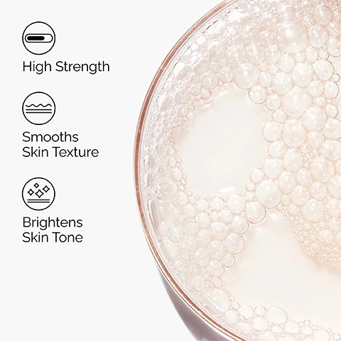 Image 1 - The image displays a close-up of a liquid with many bubbles in a round container on the right, and three bullet points on the left: a capsule icon with High Strength, a wavy lines icon with Smooths Skin Texture, and a diamonds icon with Brightens Skin Tone. Image 2 - Close-up of a persons glowing skin, with three labels indicating Exfoliating, Smoothing, and Ideal for Dry Skin. Image 3 - A clear viscous liquid flows down the right side of the image while text on the left lists Key ingredients in Lactic Acid 10% + HA: Lactic Acid An Alpha Hydroxy Acid (AHA) which exfoliates for smoother-looking skin. Hyaluronic Acid Supports skin hydration. Image 4 - The image displays three The Ordinary skincare products on a white background, representing a regimen for smooth skin: a gray tube of Squalane Cleanser, a frosted dropper bottle of Lactic Acid 10% + HA, and a gray tube of Natural Moisturizing Factors + HA, with visible text including A regimen for smooth skin. PREP ●○○ Squalane Cleanser Cleanses skin and removes makeup. TREAT ●●○ Lactic Acid 10% + HA Exfoliates for smooth skin with a high-strength formula. SEAL ●●● Natural Moisturizing Factors + HA Surface hydrator to strengthen the skin’s barrier.