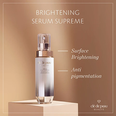 Image 1 - A cosmetic bottle labeled Brightening Serum Supreme is featured on a light brown background, accompanied by the text Surface Brightening and Anti pigmentation.
Image 2 - A woman with long brown hair is applying a skincare product on her cheek while holding a bottle in her other hand, with the text Visibly improves dark spots & clarify skin tone and the logo clé de peau BEAUTÉ visible.
Image 3 - A woman with long brown hair and blue eyes is gently touching her face, looking directly at the camera, with text overlay that says In 2 weeks, intensity of dark spots is reduced* *Self-evaluation results from 119 women after eight weeks of use.