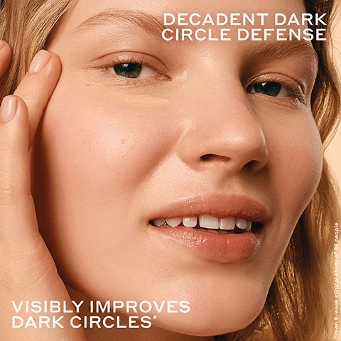 Image 2 - A close-up of a smiling womans face shows a finger applying a light product under her eye, accompanied by the text DECADENT DARK CIRCLE DEFENSE, VISIBLY IMPROVES DARK CIRCLES*, and *In an 8-week clinical study of 38 people. Image 3 - A before and after comparison image shows a persons left eye, with the under-eye area on the left showing fine lines labeled BEFORE, and the under-eye area on the right appearing smoother labeled AFTER 8 WEEKS, with the text 27% SMOOTHER UNDER EYES* *In an 8-week clinical study on 38 people. Image 4 - A before and after comparison of a persons eye showing a visible dark circle and puffiness under the left eye in the before image, and a noticeably brighter, smoother under-eye area in the after image, with the text: BEFORE, AFTER 8 WEEKS, REDUCES THE LOOK OF DARK CIRCLES*, *In an 8-week clinical study on 38 people. Image 5 - A before and after split image shows the same persons eye area, with the left side labeled BEFORE displaying darker under-eyes and the right side labeled AFTER 8 WEEKS showing visibly brighter under-eyes, along with text that states 29% BRIGHTER UNDEREYES* *In an 8-week clinical study on 38 people. Image 6 - The image displays two open orange jars of OLEHENRIKSEN Banana Bright+ Eye Crème with yellow cream, one standing with a dollop on its rim, the other tilted next to its white lid, accompanied by text that reads VISIBLY IMPROVES fine lines + wrinkles*, 92% had brighter under eyes**, and 95% had visibly reduced crows feet**, with a disclaimer at the bottom stating *In an 8-week clinical study on 38 people, **In an 8-week clinical study on 38 people, after 8 weeks. Image 7 - A light peach background features a central smear of cream-colored product, surrounded by four circular insets with ingredient visuals and text descriptions. The main title is DARK CIRCLE DEFENSE MADE DECADENT. The top left inset, showing gold particles, is labeled TRIPLE VITAMIN C COMPLEX + GOLD For improved delivery of vitamin C to target undereye dark circles and the look of fine lines + wrinkles. The top right inset, showing orange slices, is labeled BIOFLAVONOIDS Antioxidant compounds extracted from grapefruit + mandarin to help neutralize free radicals + environmental aggressors. The bottom left inset, showing orange oil with bubbles, is labeled HARDY ORANGE EXTRACT Antioxidant-rich brightening. The bottom right inset, showing bananas, is labeled BANANA POWDER-INSPIRED PIGMENTS Light-reflecting pigments to instantly brighten + blur. Image 8 - The image shows an orange background with two blurred golden orbs and white text that reads: TRIPLE VITAMIN C COMPLEX + GOLD DELIVERY SYSTEM DARK CIRCLE DEFENSE + CLINICAL BRIGHTENING Real-gold encapsulation for improved Vitamin C delivery Highly stable to retain potency Benefits are consistent with every application Instant + all day results. Image 9 - A close-up shows smooth, shimmery swatches of a light yellow cream, with the text DECADENTLY CREAMY, LUMINOUS, FRAGRANCE-FREE. Image 10 - The image shows three Ole Henriksen skincare products—a pink Pout Preserve Peptide Lip Treatment tube with a visible drop of product, an orange Banana Bright+ Eye Crème jar, and a purple Strength Trainer Peptide Boost Moisturizer jar—against a light peach background, with visible text that reads: BEST OF OLE, PLUMP POUT, POUT PRESERVE LIP TREATMENT, Ultra-nourishing lip treatment to plump with hydration + get clinically fuller-looking lips in 1 week*, BRIGHT EYES, BANANA BRIGHT+ EYE CRÈME, Illuminating eye crème to visibly improve dark circles + crows feet**, BOUNCY SKIN, STRENGTH MOISTURIZER, Daily moisturizer for firmer, bouncier skin in 1 week***, OLEHENRIKSEN Pout Preserve Peptide Lip Treatment Kokum butter, açai sterols & peptides Beurre de kokum, sterols d’açaí et peptides, OLEHENRIKSEN TRUTH Banana Bright+ Eye Crème Gold-complexed vitamin C & banana, powder-inspired pigments Vitamine C gold et pigments inspirés de la poudre de banane, OLEHENRIKSEN STRENGTH Strength Trainer Peptide Boost Moisturizer Vegan peptides & ceramides Peptides et céramides vegan, *In an 8-week clinical study of 39 people, **38 people, ***35 people.