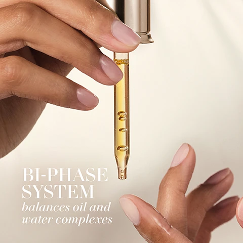 Image 1 - A hand holding a dropper filled with a yellow liquid, with another hand reaching towards it, accompanied by the text BI-PHASE SYSTEM balances oil and water complexes.
Image 2 - A close-up of a womans face showcasing smooth skin and gentle features, with the words ABSORBS Instantly prominently displayed.
Image 3 - An abstract image of golden oil with bubbles, featuring the text Infinity Oil Complex at the top and a list of oils including Cranberry Oil, Olive Oil, Camelina Oil, Rapeseed Oil, Sweet Almond Oil, Jojoba Oil, Meadowfoam Oil, and Sea Buckthorn Oil on the left side.
Image 4 - An abstract image featuring translucent water droplets against a soft blue background, with the text Hydro Fusion Complex and Marine and Peptide Powered visible.
