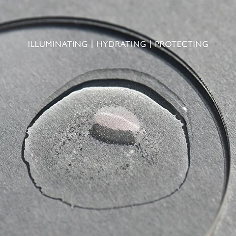 Product droplet on a clear palette with the text ILLUMINATING, HYDRATING, PROTECTING.