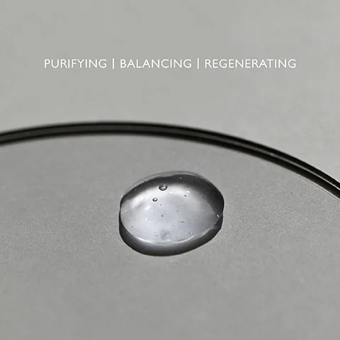Product droplet on a clear palette with the text PURIFYING, BALANCING, REGENERATING.
