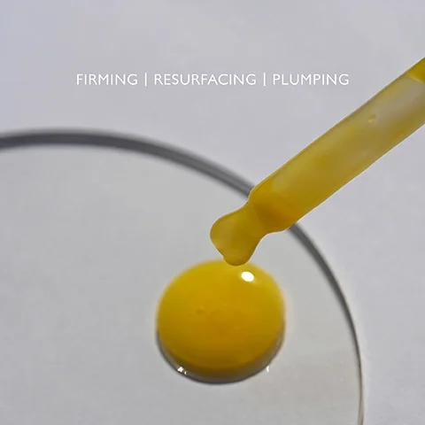 Product droplet on a clear palette with the text FIRMING, RESURFACING, PLUMPING.