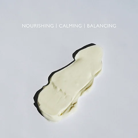 Product swatch on a grey background with the text NOURISHING, CALMING, BALANCING.