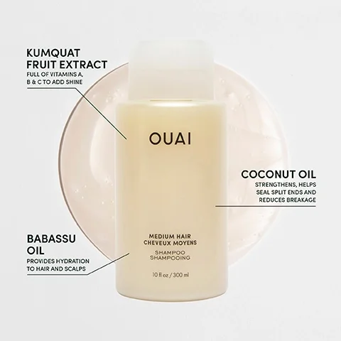 A bottle of Ouai shampoo for medium hair is set against a light background, featuring labels highlighting kumquat fruit extract, coconut oil, and babassu oil, with visible text detailing their benefits.