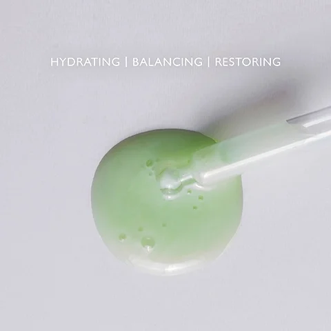 Product droplet on a clear palette with the text HYDRATING, BALANCING, RESTORING.