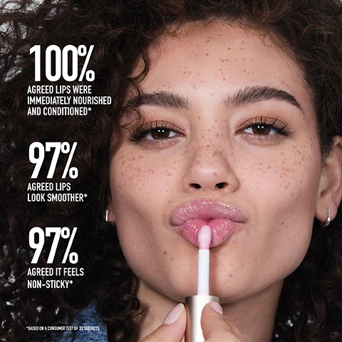 Image 1 - A woman with curly hair is applying lip gloss, with statistics about the products effectiveness displayed on the left side, indicating 100% agreed lips were immediately nourished and conditioned, 97% agreed lips look smoother, and 97% agreed it feels non-sticky.
Image 2 - A lip product from bareMinerals is displayed amid colorful gel drops, with text explaining its benefits: BOTANICALLY INFUSED SOFTNESS NOURISHES FOR SOFT, SUPPLE LIPS Hydrating Botanical Oil Blend PROTECTS, SOOTHES AND CALMS Blue Agave Extract MOISTURIZES AND CONDITIONS Shea Butter.
Image 3 - A drop of pink lip oil is being dispensed from a white applicator above a clear bottle with a pink label, featuring the text Nourishing Lip Oil and Amazing Glaze, along with bullet points highlighting its features: High-impact shine, Delivers deep, lasting hydration, Perfect for all skin tones, Power-packed botanical blend, Featherlight feel.
Image 4 - Image shows three lip products from bareMinerals organized horizontally with descriptions: Nourishing Lip Oil, Mineralist Lip Gloss-Balm, and Dewy Lip Gloss-Balm, along with the text BRING YOUR Shine and NEW in a stylish font.