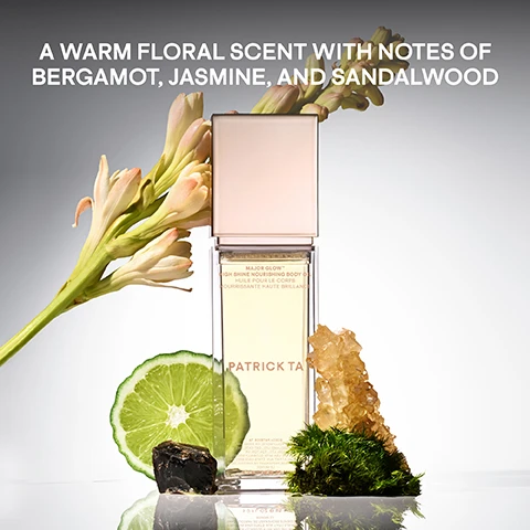 Image 1 - A perfume bottle with a sleek design is surrounded by flowers, a lime slice, a rock crystal, and moss, with the text A WARM FLORAL SCENT WITH NOTES OF BERGAMOT, JASMINE, AND SANDALWOOD displayed above.
Image 2 - A side-by-side comparison of two knees, with the left knee appearing dry with a matte finish labeled BEFORE, and the right knee looking smooth and shiny, labeled HYDRATION WITH A HIGH SHINE FINISH.
Image 3 - The image shows two close-up shots of knees; the left side labeled BEFORE and the right side labeled HYDRATION WITH A HIGH SHINE FINISH showing the difference in skin appearance.
Image 4 - Image depicts three circular drops of a light-colored body oil on a white background, with text stating BODY OIL WITH BENEFITS, DEEPLY MOISTURIZES, PROTECTS THE SKIN, and IMPROVES THE MOISTURE BARRIER.
Image 5 - A collection of body care products by Patrick Ta, featuring several bottles and jars with a soft pink and gold color scheme, surrounded by lime slices and tropical flowers, with the text BODY CARE MADE TO BE SEEN and SHOP THE FULL COLLECTION displayed above and below the products.