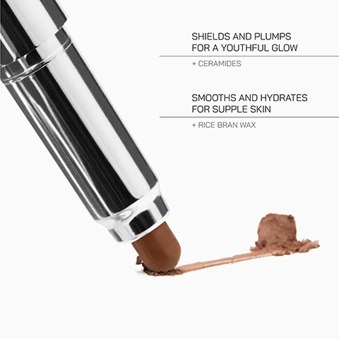 Image 1 - A makeup stick is shown creating a swatch on a white surface next to text that reads SHIELDS AND PLUMPS FOR A YOUTHFUL GLOW + CERAMIDES SMOOTHS AND HYDRATES FOR SUPPLE SKIN + RICE BRAN WAX. Image 2 - A diagram titled SKIN-TONE GUIDE showing three skin tone categories FAIR, MEDIUM, and DEEP, each with associated shade names including BEECH, BIRCH, WILLOW, OAK, ROSEWOOD, PINE, MAPLE, WALNUT, ASH, and MAHOGANY.
