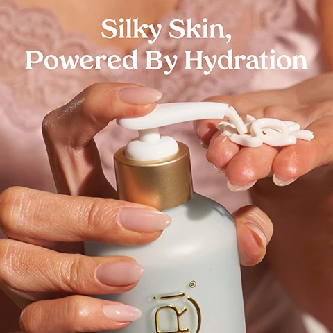Image 1 - A person holds a bottle of lotion with a pump dispenser, applying a small amount to their fingers, and the visible text reads Silky Skin, Powered By Hydration.
Image 2 - A person is applying a light-colored cream from a bottle labeled Kopari, with visible text that states Deep hydration, Locks in moisture, Softens & smooths, Absorbs quickly.
Image 3 - Image shows a split screen comparing two legs, one labeled BEFORE with a drier appearance on the left and the other labeled AFTER with a hydrated and shiny look on the right, along with the text For Hydrated & Nourished Skin at the top.
Image 4 - A bottle of Kopari Hydrating Silk Body Cream with a pump top is surrounded by white flowers and a coconut, with text that reads Powerhouse Ingredients and HYDRATING Hyaluronic & Polyglutamic Acids.
Image 5 - A light blue bottle of Kopari hydrating body cream is shown with a pump top, featuring text that states various percentages of customer satisfaction: 98% said cream hydrates without feeling heavy, 98% said cream revitalizes dry, dull skin, 96% said cream moisturizes dry, flaky skin, and 94% said moisture barrier feels restored.