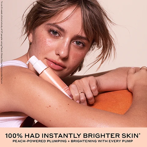 Image 1 - A woman with freckles holds a peach-colored serum bottle on an orange surface with visible text OLEHENRIKSEN TRUTH Peach Glaze Glow Niacinamide Serum *In an 8-week clinical study of 37 people using Peach Glaze Glow Niacinamide Serum 100% HAD INSTANTLY BRIGHTER SKIN* PEACH-POWERED PLUMPING + BRIGHTENING WITH EVERY PUMP. Image 2 - Before and after image of a persons face showing skin improvement after 8 weeks, with text that reads BEFORE, 8 WEEKS, 96% SAW A NOTICABLE IMPROVEMENT TO THEIR SKIN*, and *In an 8-week clinical study on 37 people. Image 3 - Before and after photo of a womans cheek skin showing reduced pores with text BEFORE and 4 WEEKS and below text IMPROVES THE APPEARANCE OF PORES* *In an 8-week clinical study on 37 people. Image 4 - Before and after image of a womans face showing instantly brighter and plumper skin compared to the before side, with text that reads INSTANTLY BRIGHTENS + PLUMPS SKIN WITH HYDRATION* *In an 8-week clinical study on 37 people. Image 5 - A bottle of OLEHENRIKSEN Peach Glaze Niacinamide Serum sits between two peach halves with text overlay reading OLEHENRIKSEN TRUTH Peach Glaze Niacinamide Serum Peach extract, niacinamide & vitamin E Extrait de pêche, niacinamide et vitamine E 94% saw instantly plumper-looking skin* 97% had instantly smaller-looking pores* 100% had instantly brighter skin* *In an 8-week clinical study of 37 people. Image 6 - A swatch of peach-colored serum is shown with text PEACH-POWERED BRIGHTENING + PLUMPING HYDRATION and descriptions for four ingredients: Peach Extract + Juice brighten + provide antioxidant-rich hydration, Niacinamide brightens+ reduces the appearance of pores, Hyaluronic + Polyglutamic Acid hydrate + bind moisture, and Enhanced Vitamin C brightens + defends against pollution. Image 7 - A close-up of a cosmetic bottle pump dispensing peach gel with text reading Cushiony gel Juicy peach scent Luminous finish. Image 8 - Image shows a peach next to three OLEHENRIKSEN Peach Glaze skincare products including a lip treatment, mist, and serum with text reading THE JUICY CLINICAL RESULTS YOUR SKIN CRAVES, PEACH GLAZE GLOW NIACINAMIDE SERUM A plush, peach-powered gel serum to clinically brighten+ plump with every pump* *In a 4-week clinical study on 37 people, PEACH GLAZE GLOW MIST An ultra-fine facial mist for brightening + hydration instantly and over time** **In a 4-week clinical study on 38 people, and PEACH GLAZE POUT PRESERVE A juicy squeeze of sweet peach for fuller-looking lips in 1 week*** ***In a 8-week clinical study on 39 people. Image 9 - Three bottles of OLEHENRIKSEN serum with product swatches on a peach background with the text BRIGHTEN WITH OLE OLEHENRIKSEN TRUTH Peach Glaze Glow Niacinamide Serum Peach extract niacinamide & vitamin C Extrait de pêche niacinamide et vitamine C OLEHENRIKSEN TRUTH Banana Bright Vitamin C Serum 15% vitamin C 5% PHAs & hyaluronic acid 15% de vitamine C 5% de PHA et acide hyaluronique OLEHENRIKSEN TRUTH Truth Serum Collagen boosted with True-C Complex Boosté en collagène True-C Complex PEACH GLAZE GLOW SERUM Vitamin C peach extract + niacinamide for brightening + antioxidant-rich hydration BANANA BRIGHT SERUM 15% vitamin C + 5% PHA to visibly reduce dark spots TRUTH SERUM True-C Complex to brighten + condition skin.